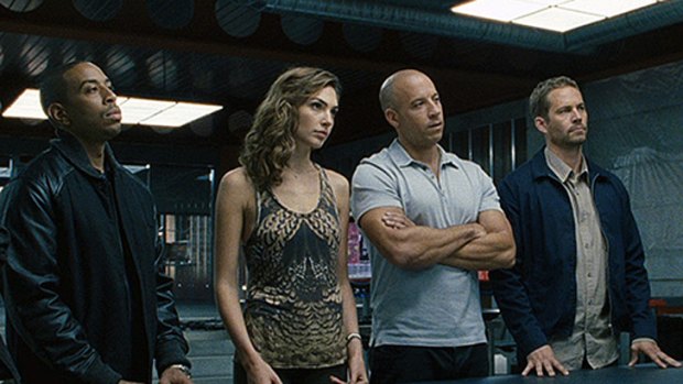 <i>Fast & Furious 7</i> resumes filming with Vin Diesel and Ludachris (pictured) after Paul Walker (far right)  died in a car accident last year.