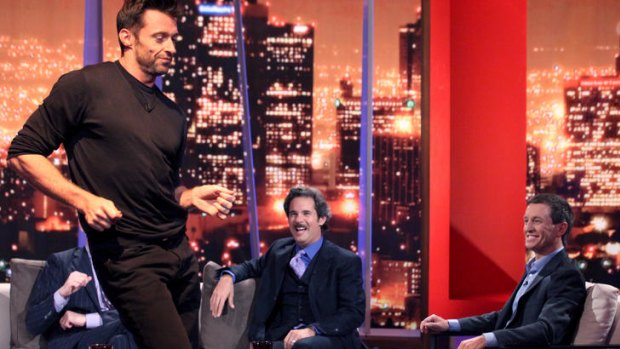 Clowning around ... Paul F. Tompkins looks on as Hugh Jackman shows off for Rove.