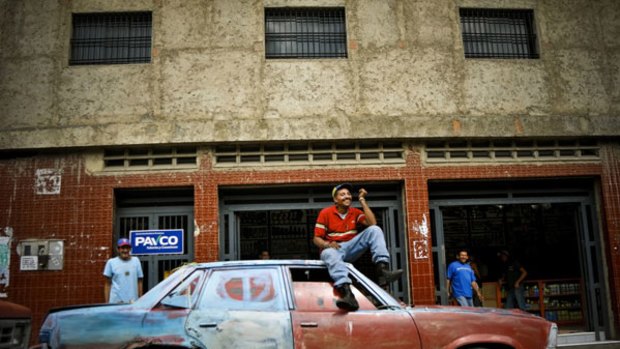 Luis Jose Alfonso Gonzalez sits on his 1978 Chevrolet Malibu V8 in Naiguat, a small coast town near Caracas.