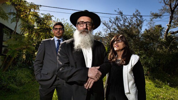 Manny Waks, with his parents, Zephaniah and Chaya, outside their East St Kilda home.