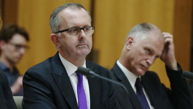 Acting Electoral Commissioner Tom Rogers and state manager and Australian electoral officer for Western Australia Paul Kramer at a Senate hearing into the last election.