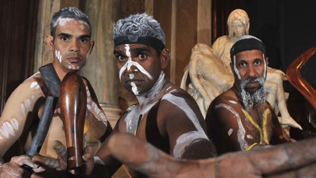 Spiritual fusion... Aboriginal dancers perform in front of a cast of Michelangelo's Pieta in St Peter's Basilica in the Vatican.