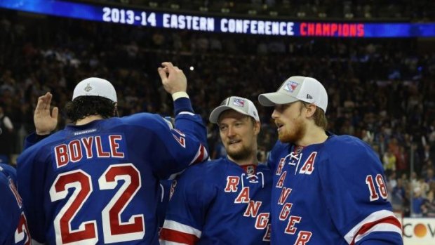 The New York Rangers celebrates making the Stanley Cup playoffs with their defeat of the Montreal Canadiens.