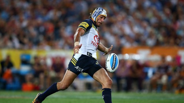 The moment: Johnathan Thurston on his way to nailing the match-winning field goal in golden point extra time.