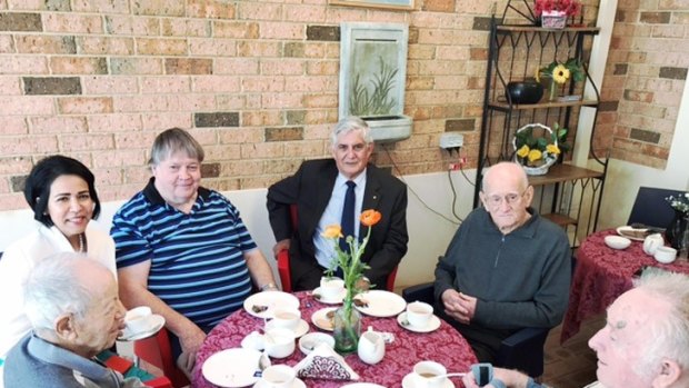 Aged Care Minister Ken Wyatt meets residents at a facility.
