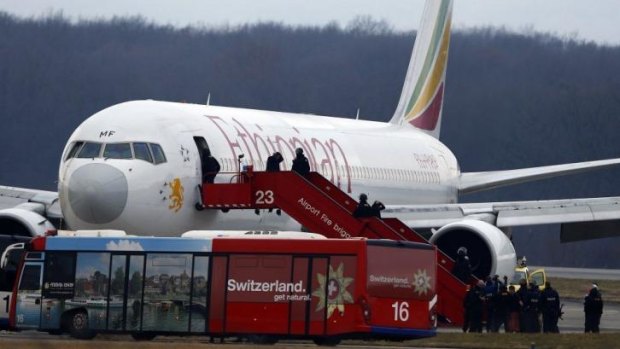 Passengers leave the hijacked plane after its safe landing in Geneva.