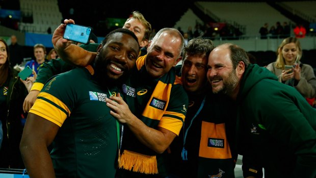 LONDON, ENGLAND - OCTOBER 30:  Tendai Mtawarira of South Africa poses for selfie photographs with fans after the 2015 Rugby World Cup Bronze Final match between South Africa and Argentina at the Olympic Stadium on October 30, 2015 in London, United Kingdom.  (Photo by Mike Hewitt/Getty Images)