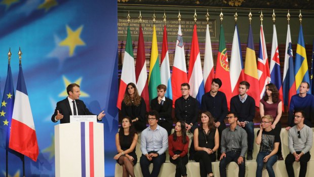 Students assemble to hear Emmanuel Macron's vision for a stronger Europe, with a joint budget for countries sharing the euro currency and a stronger global voice despite Brexit looming.