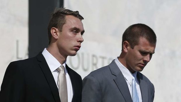 Former ADFA cadets Dylan Deblaquiere, left, and Daniel McDonald, centre, leave the ACT Supreme Court after appearing in relation to the ADFA skype scandal.