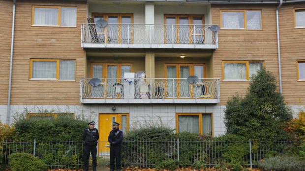 Police continue to stand guard  outside a South London block of flats that is being investigated in connection with an alleged slavery case.