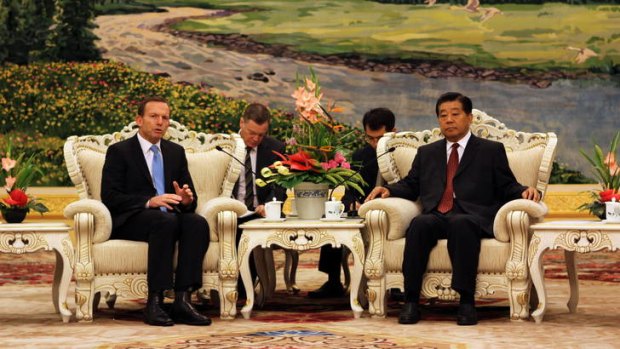 Avoiding gratuitous public advice &#8230; Tony Abbott at a meeting with Jia Qinglin, a senior member of the Chinese government.