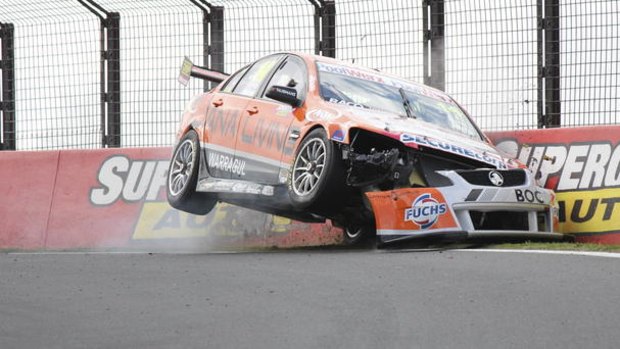 Bumper: Jason Bargwanna of Jana Living Racing drives his Holden into the wall during qualifying on Mount Panorama.