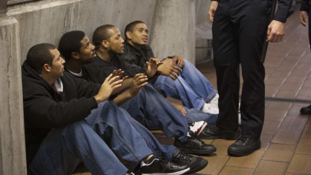 Oscar Grant (Michael B. Jordan, second from left) is taken from a train by transit police on New Year's Eve, 2008.