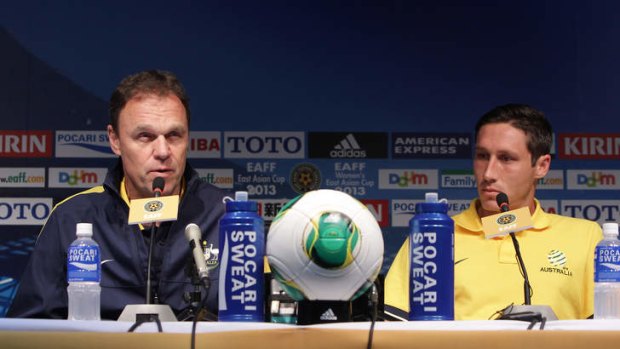 Socceroos coach Holger Osieck (left) with Mark Milligan on Thursday.
