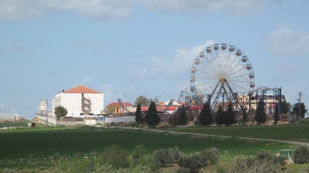 Road to Nazareth ... the hand-made ferris wheel of Jenin tourist park rises above the West Bank.