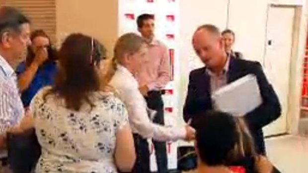 Kate Jones' offer of a handshake is declined by Campbell Newman.