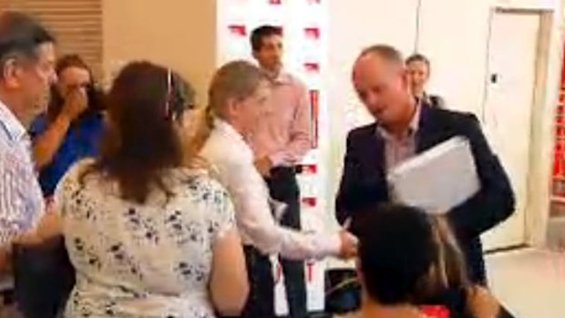 Kate Jones' offer of a handshake is declined by Campbell Newman.