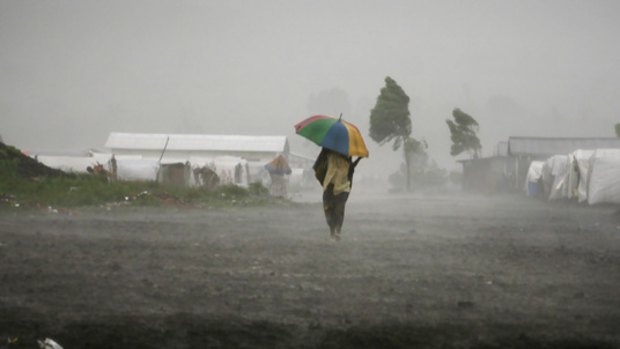 Rain sweeps through a displaced persons'  camp north of Goma, where a ceasefire between the Congolese Government and rebel forces hangs in the balance.