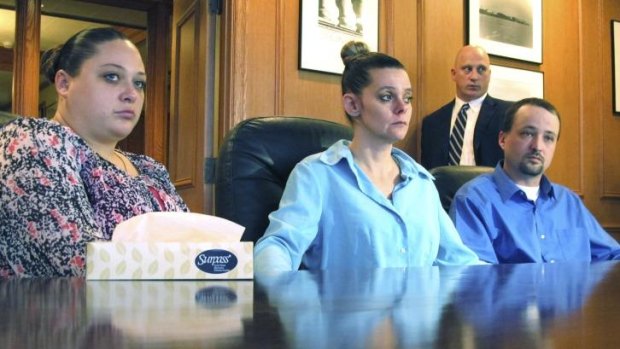 Cruel and unusual punishment: Amber McGuire, left, and her brother Dennis McGuire, pictured with his wife Missie, announce they will take legal action against the state of Ohio.