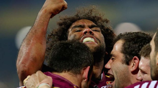Answered their critics: Sam Thaiday of the Maroons celebrates with team mates after scoring a try in Origin II.