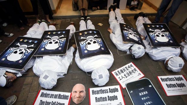 Local and mainland Chinese university students play dead to highlight the cause of Apple factory workers.