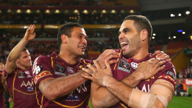 Justin Hodges and Greg Inglis celebrate the Maroons' win.