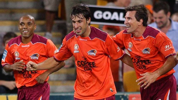 Thomas Broich of the Roar celebrates after scoring.