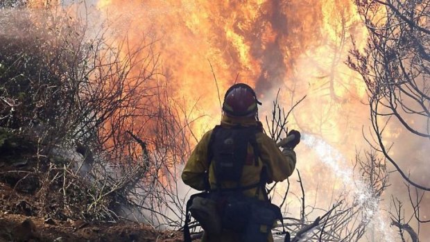 An eight-kilometre fire front burns in Karijini National Park