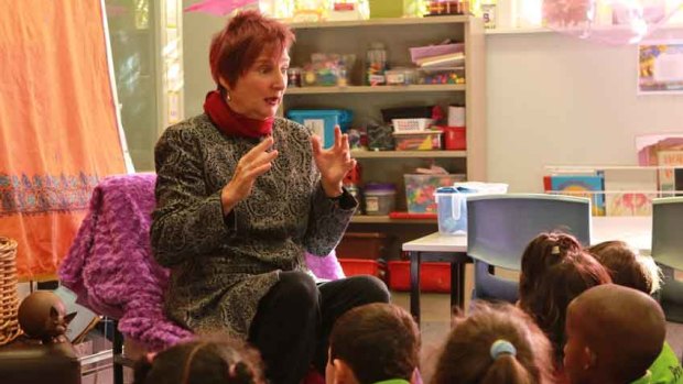 Julie Perrin tells a story to prep students at Coolaroo South Primary School.