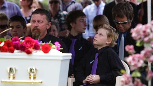 John Tyson and his son Kyle at the funeral