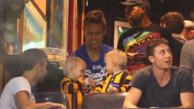 Hawthorn's Sam Mitchell with his twins at the VFL grand final.