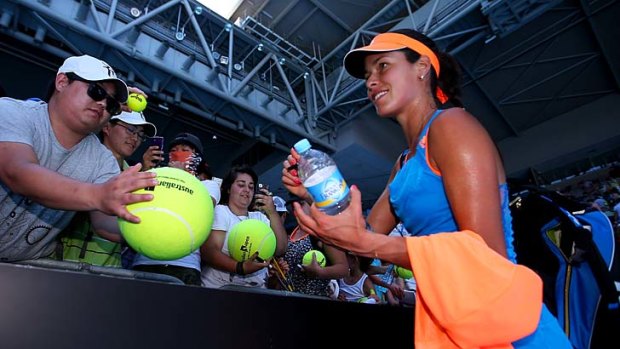 Successful run: Ana Ivanovic signs autographs after winning her first-round match.