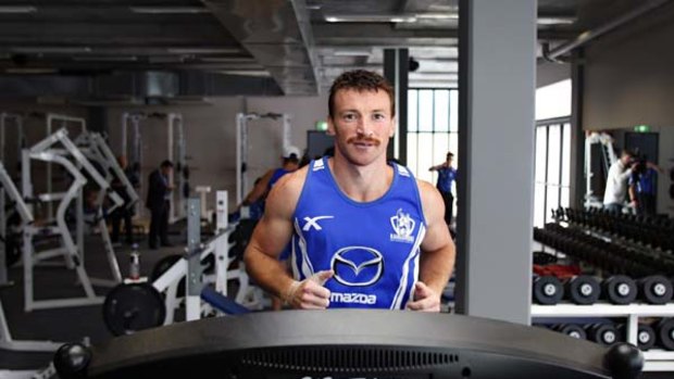 Skipper Brent Harvey trains on the treadmill in North Melbourne's new state-of-the-art gymnasium soon after its November opening.