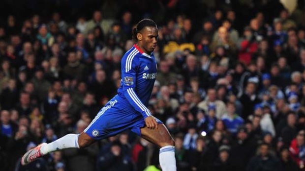 Didier Drogba of Chelsea scores from the penalty spot.