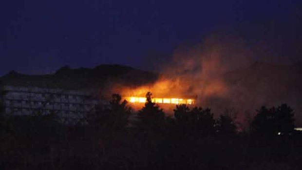 A NATO helicopter fires a missile onto the roof of the Intercontinental hotel in Kabul.