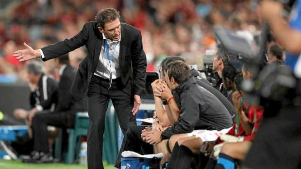 Wanderers coach Tony Popovic feels the pressure at half-time during the semi-final against Brisbane Roar on Friday night.