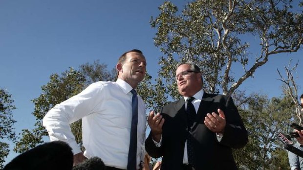 Opposition Leader Tony Abbott with Liberal MP Ewen Jones during a roads announcement in Townsville.