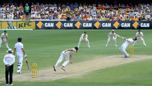 Thunderbolts and lightning: An inspired Mitchell Johnson lets fly at England's Ian Bell at the Gabba on Sunday.