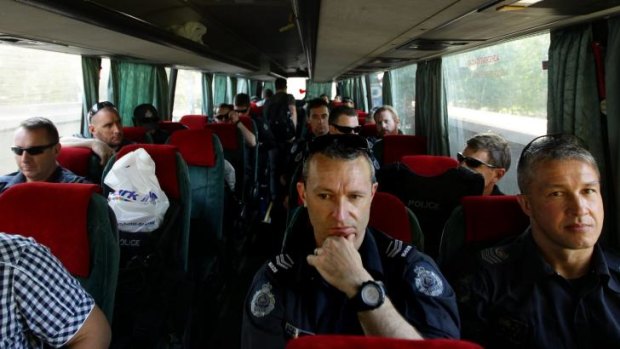 AFP officers on a bus head to Soledar village.