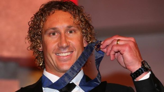Matt Priddis poses with the 2014 Brownlow Medal after winning the honour on Monday night.