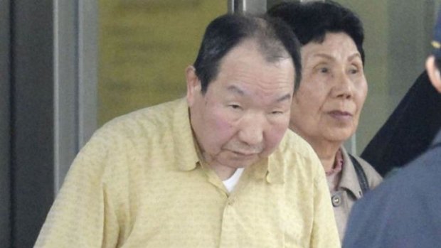 Released after 48 years behind bars ... Death row inmate Iwao Hakamada (left), flanked by his sister Hideko, is released from Tokyo Detention House.