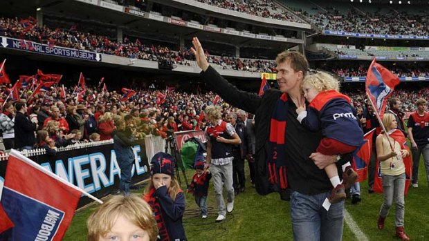 Stynes walks a lap of the MCG before the round 11 game between the Demons and the Magpies in 2008.