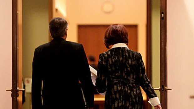 Julia Gillard and her deputy, Wayne Swan, enter yesterday's cabinet meeting.