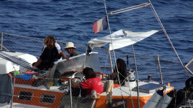 This undated photo provided Friday, April 10, 2009 by the French Navy shows unidentified individuals aboard the French sailboat Tanit, off the coast of Somalia.