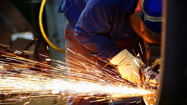 Sparks fly: The high dollar is hitting manufacturers' ability to compete.