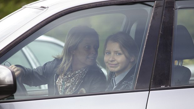 One week after her ordeal, Madeleine Pulver on her way to school. Two weeks after her ordeal, police make an arrest in the USA.