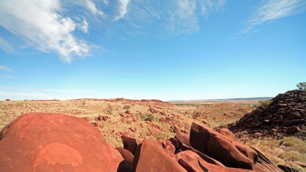 The country of the Burrup Peninsula, with petroglyph, or rock art, in the foreground.