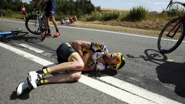 Lotto-Jumbo rider Laurens ten Dam of the Netherlands lies on the ground after the massive crash.