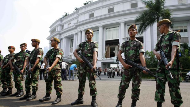 Soldiers threw a cordon around Jakarta's Ritz-Carlton hotel, one of two hotels struck by suicide bombers.