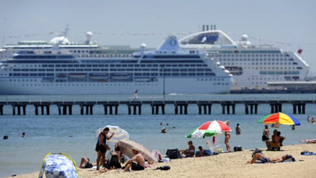Rising heat  ... beachgoers at South Melbourne today.